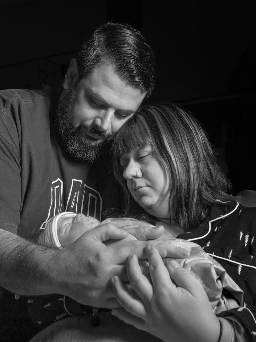 Harley and Teryn holding their son, Noah